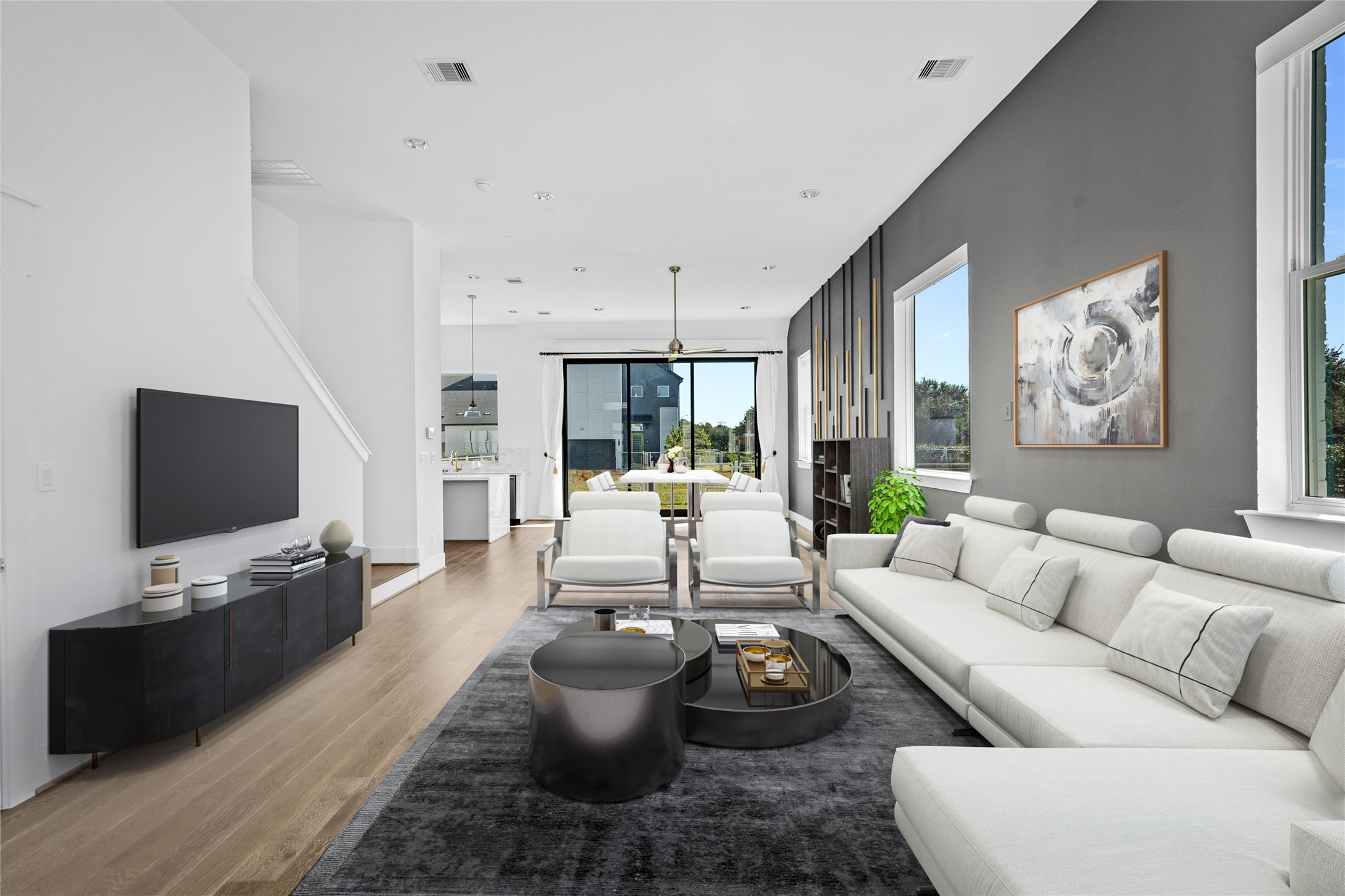 9855 Mocking Bird Hill Lane Houston, TX 77080 - Photo 2 of 15 a living room with furniture potted plant and a flat screen tv