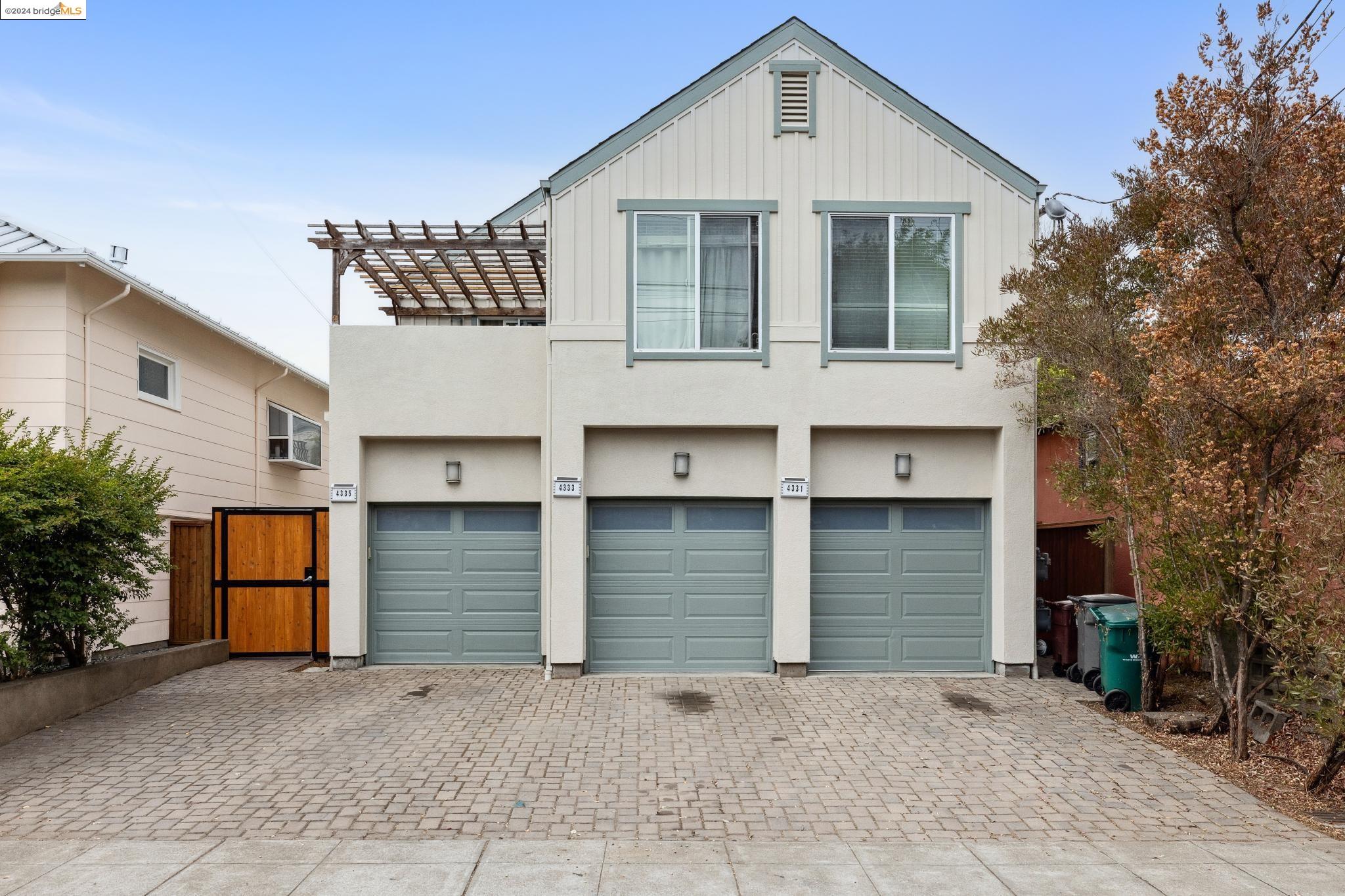 a front view of a house with garage