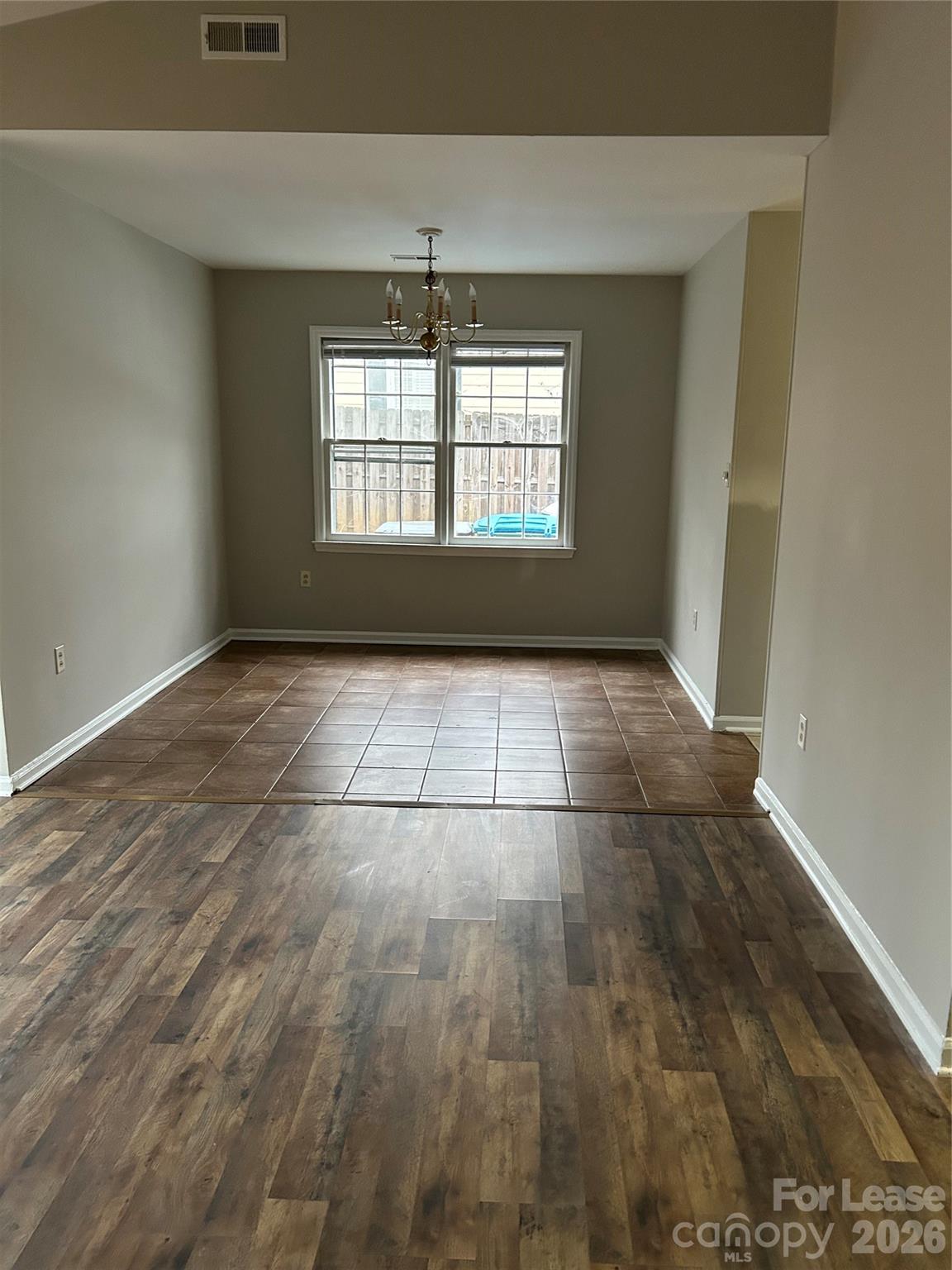 506 Fence Post Lane Matthews, NC 28105 - Photo 3 of 9 a view of an empty room with a window