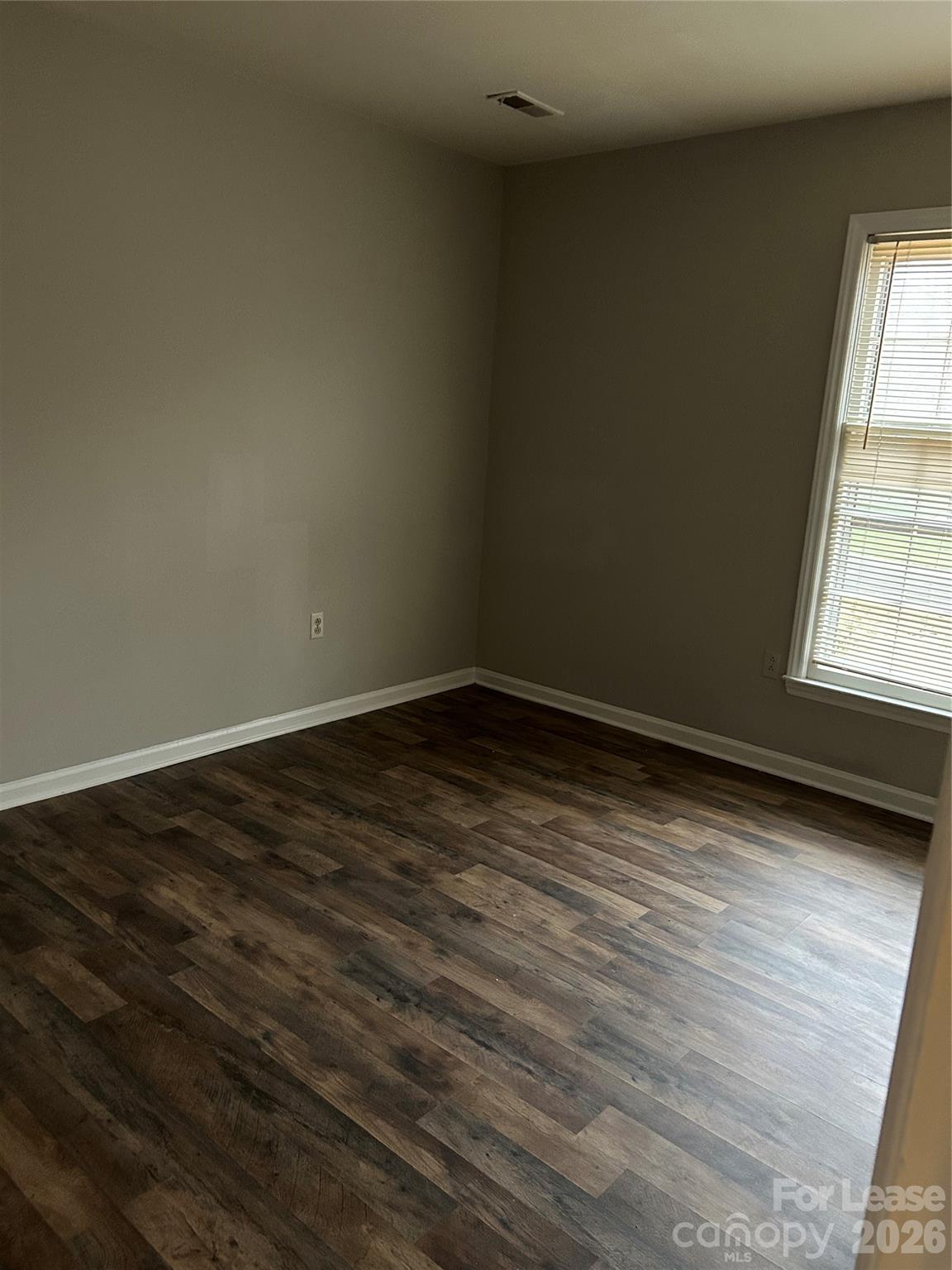 506 Fence Post Lane Matthews, NC 28105 - Photo 5 of 9 a view of an empty room and window