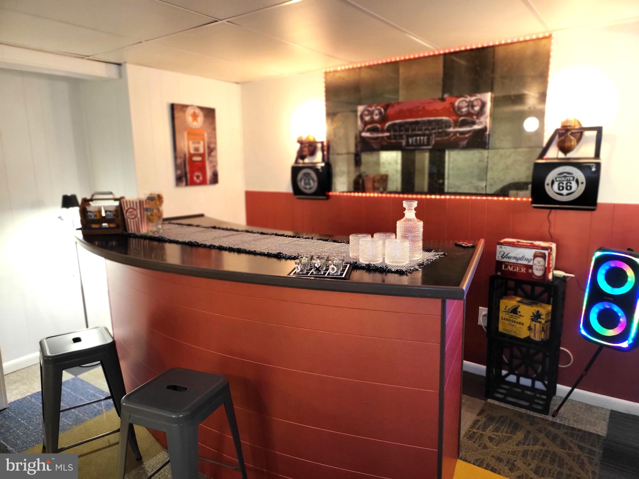 3408 Ridgeway Road Harrisburg, PA 17109 - Photo 30 of 40 Retro-inspired home bar with vibrant decor.