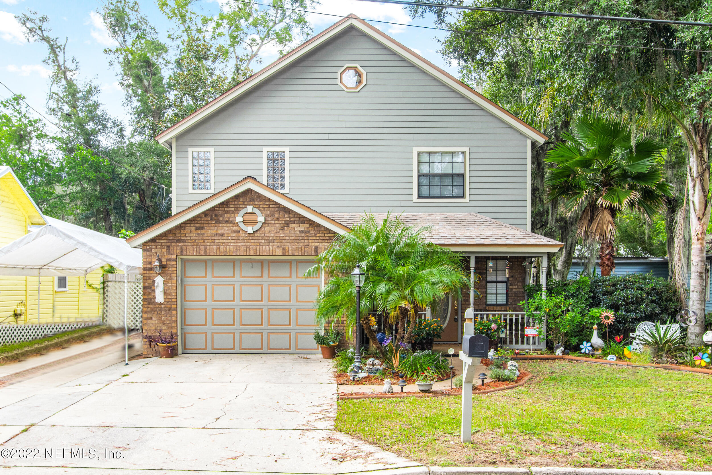 a front view of a house with garden