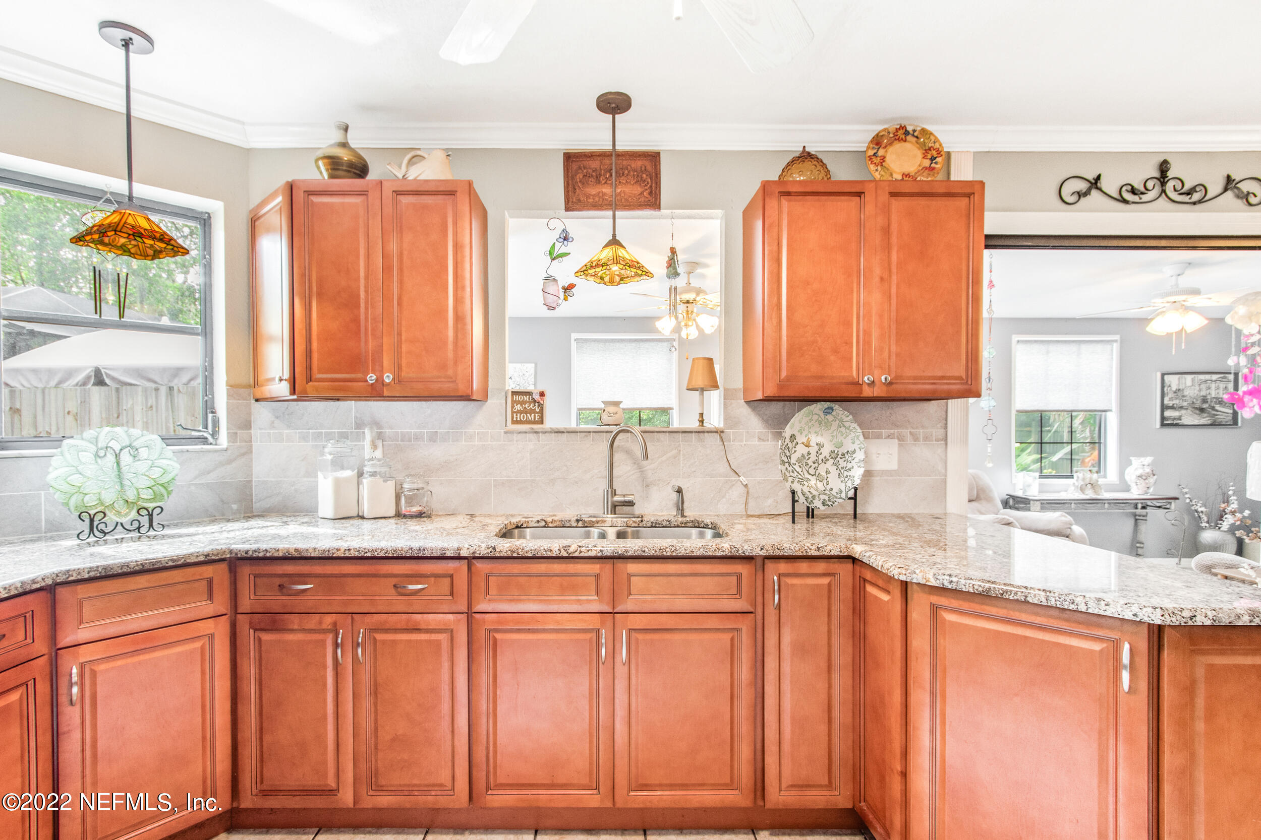 19 Madeore Street St. Augustine, FL 32084 - Photo 14 of 28 a kitchen with granite countertop a sink stainless steel appliances and cabinets