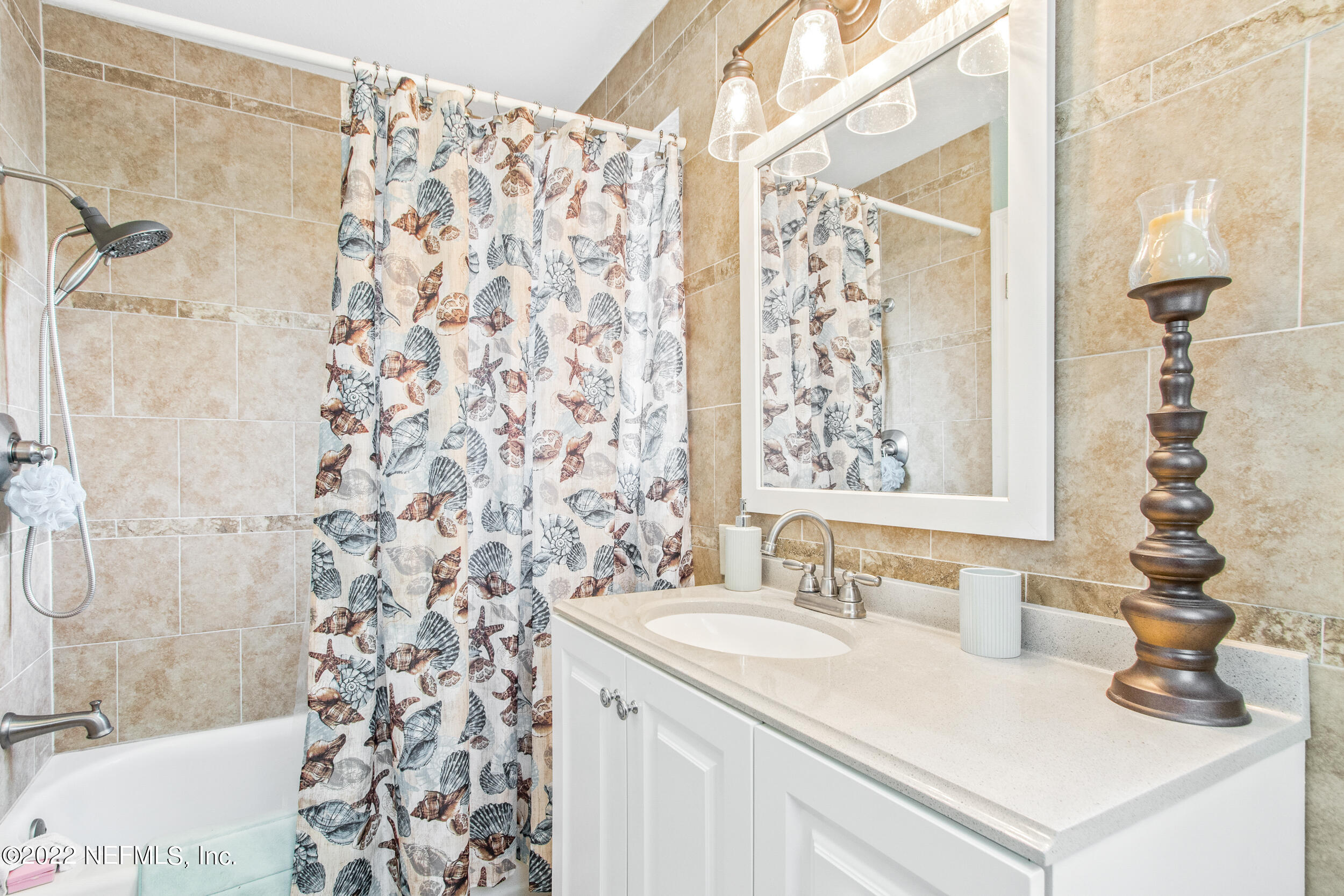 19 Madeore Street St. Augustine, FL 32084 - Photo 23 of 28 a bathroom with a sink and a mirror