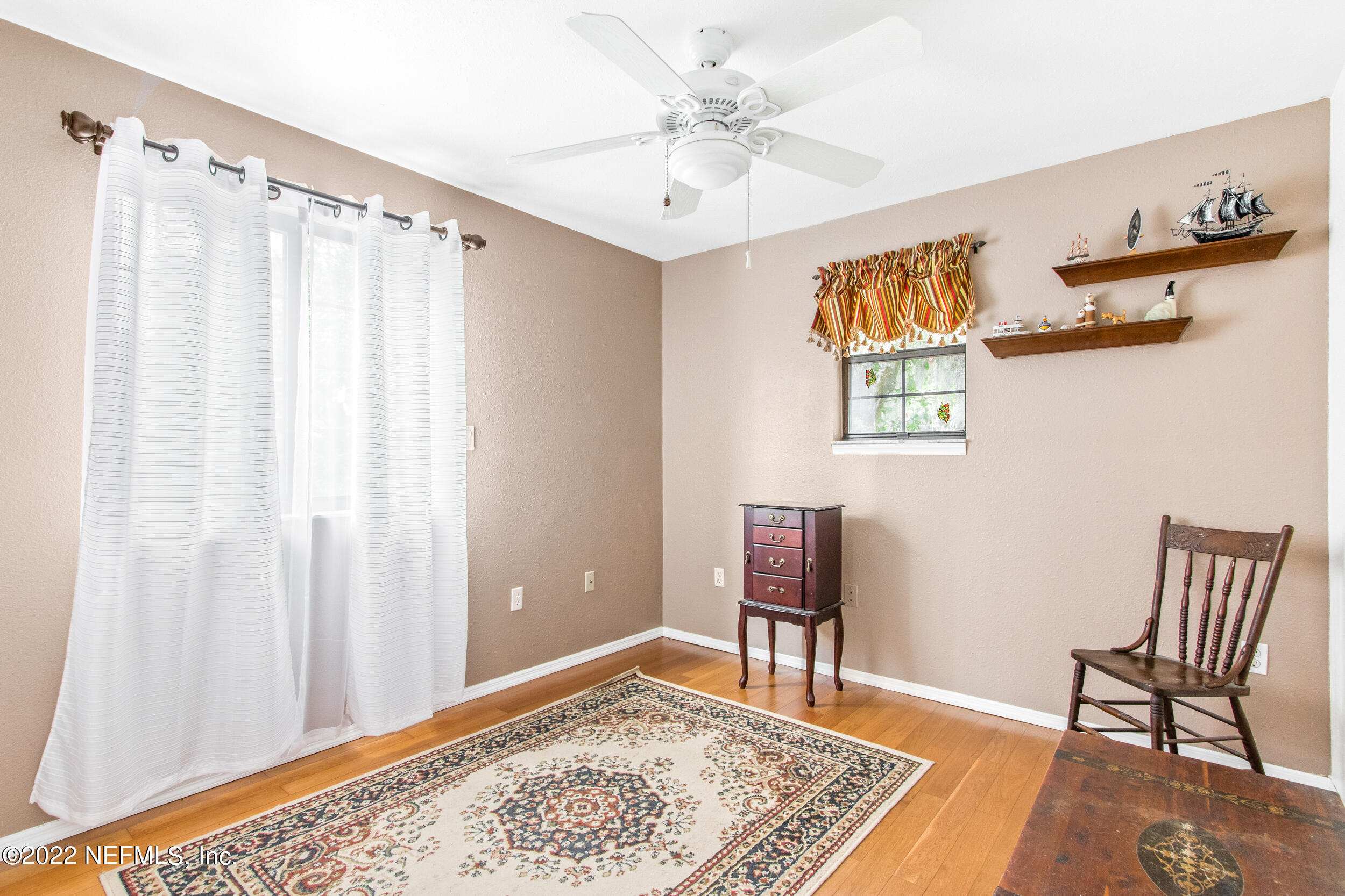 19 Madeore Street St. Augustine, FL 32084 - Photo 24 of 28 a view of a bedroom with furniture and wooden floor