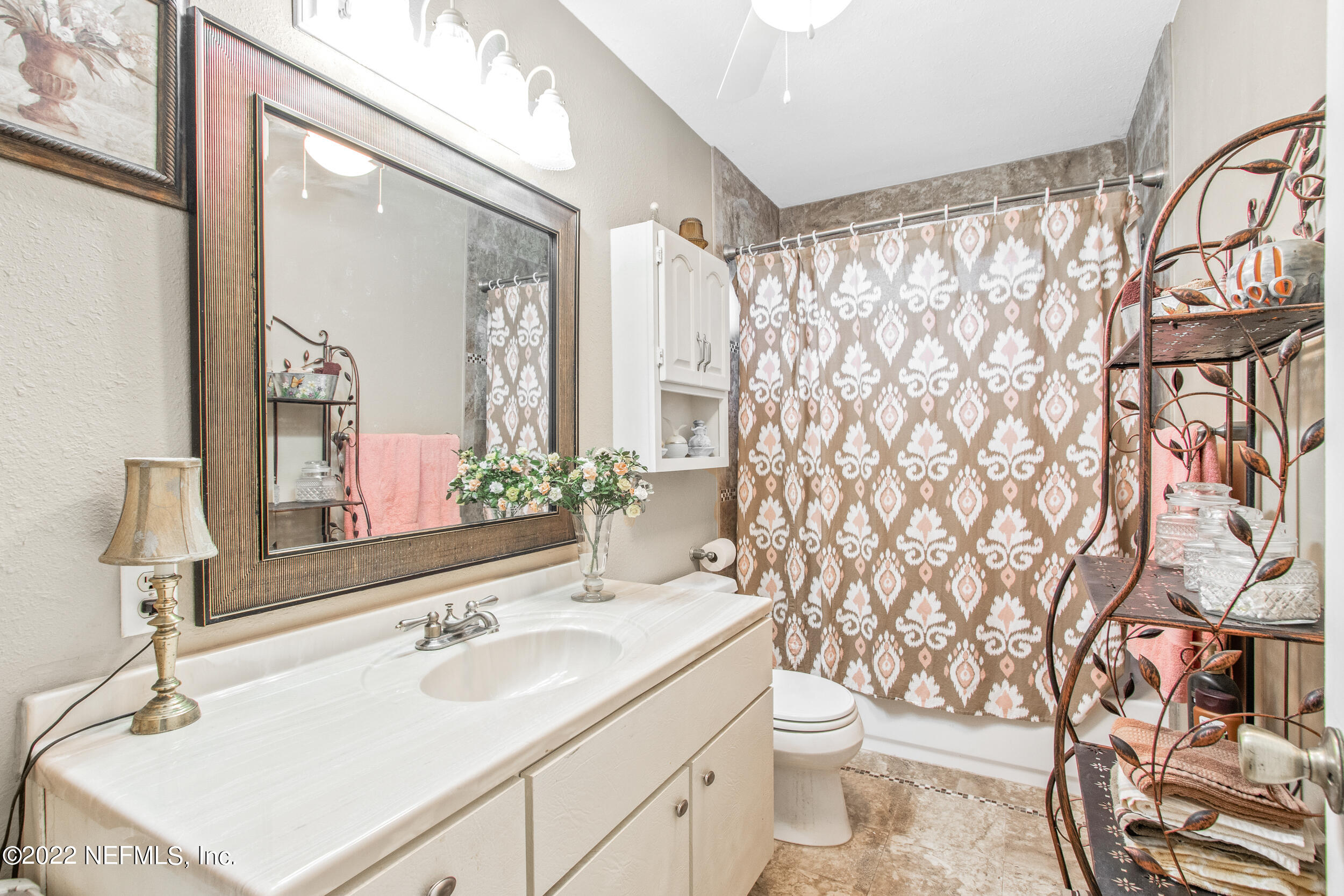 19 Madeore Street St. Augustine, FL 32084 - Photo 26 of 28 a bathroom with a sink toilet and shower