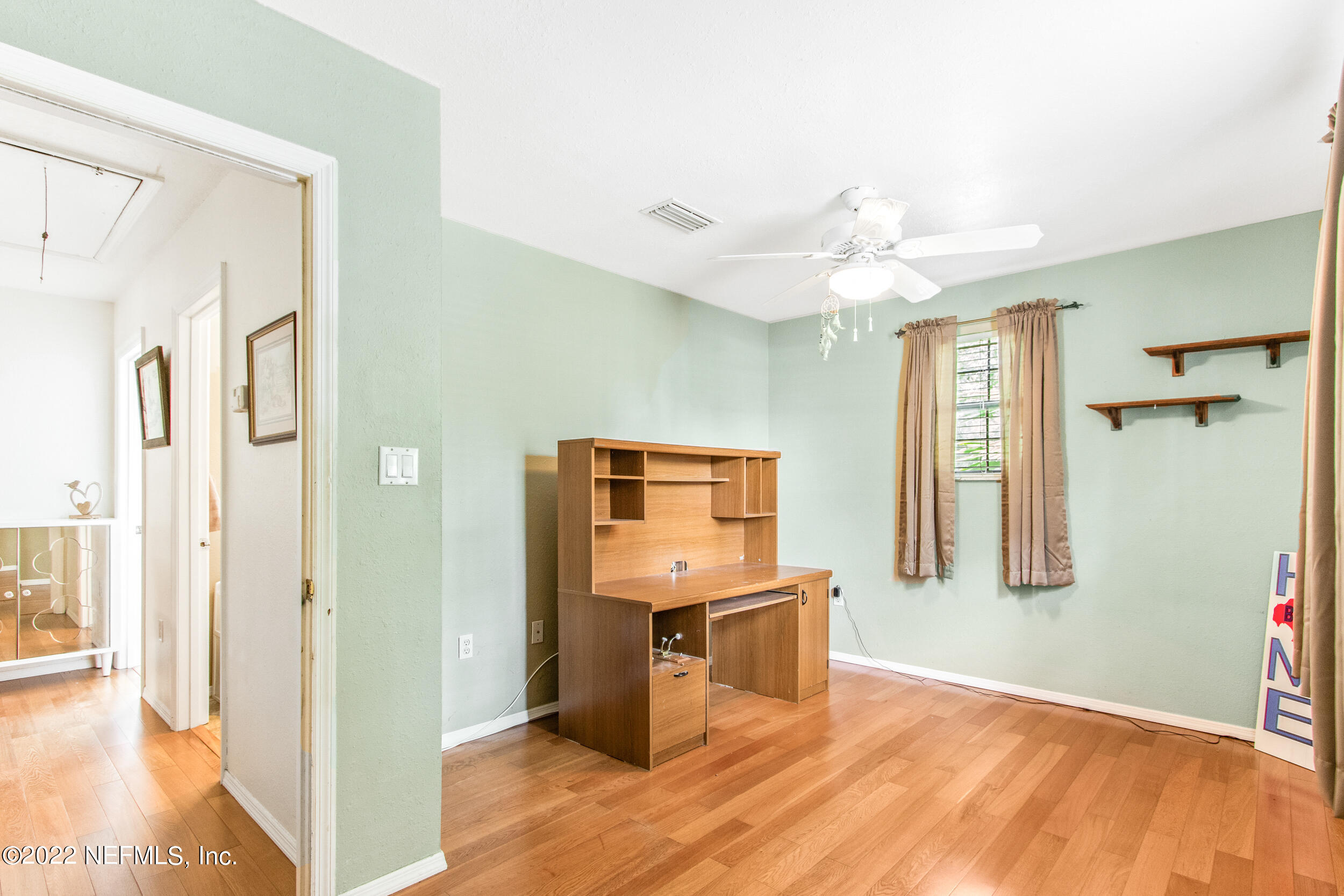 19 Madeore Street St. Augustine, FL 32084 - Photo 27 of 28 a view of a kitchen with an entryway and wooden floor