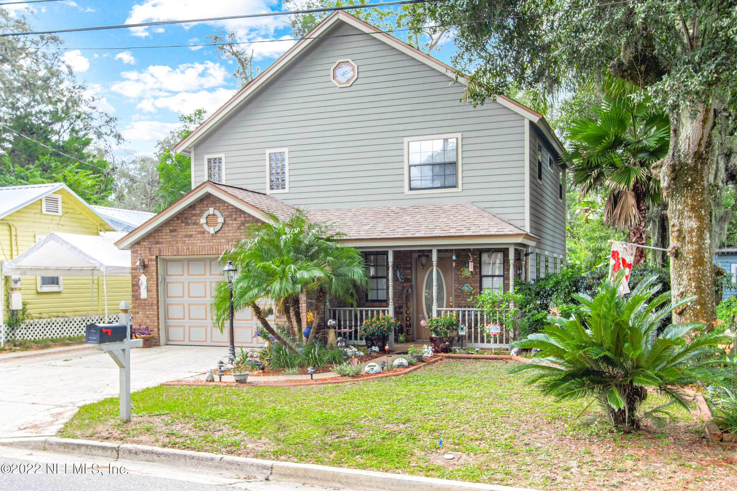 19 Madeore Street St. Augustine, FL 32084 - Photo 3 of 28 a front view of house with yard outdoor seating and yard