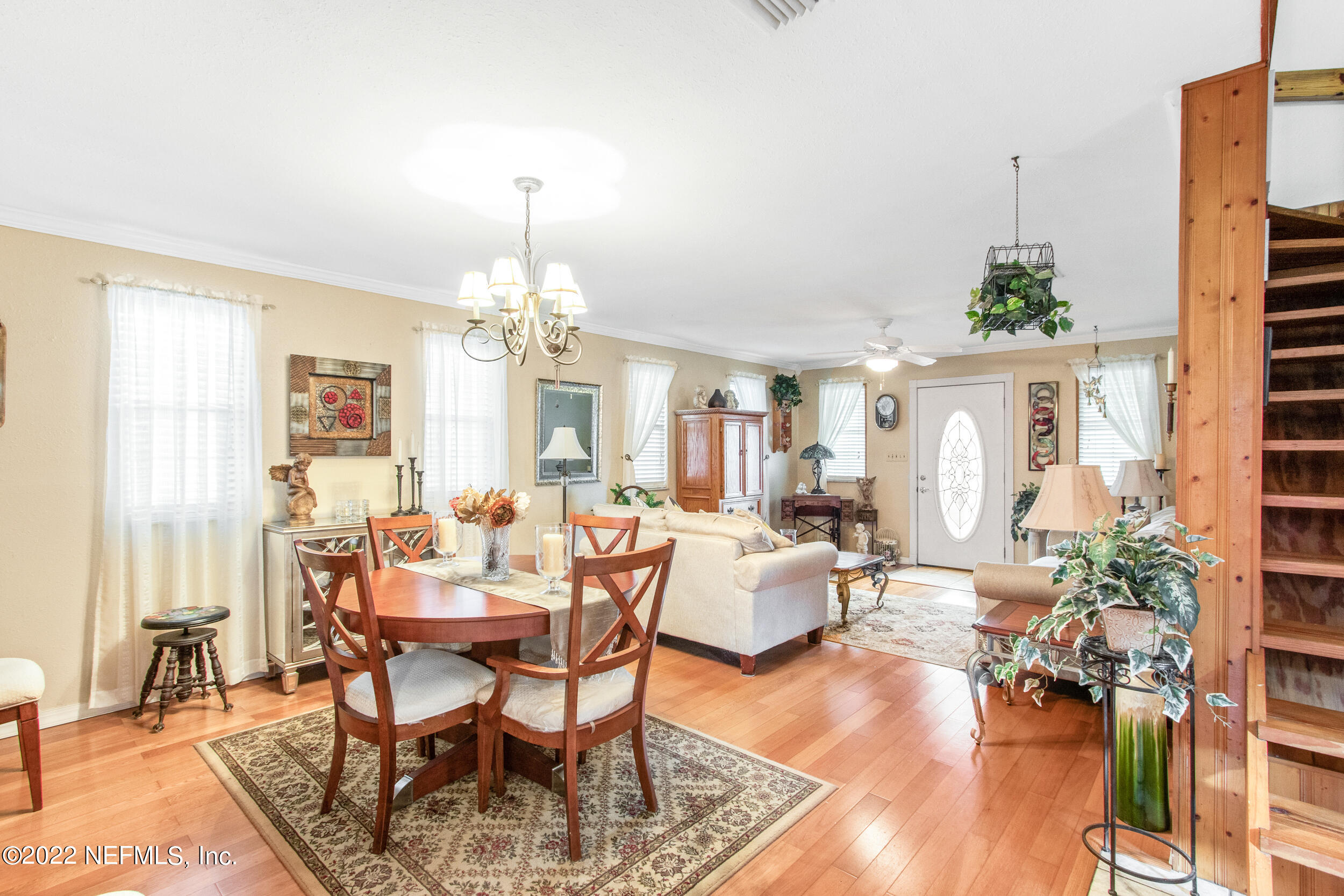 19 Madeore Street St. Augustine, FL 32084 - Photo 9 of 28 a view of a dining room with furniture window and wooden floor