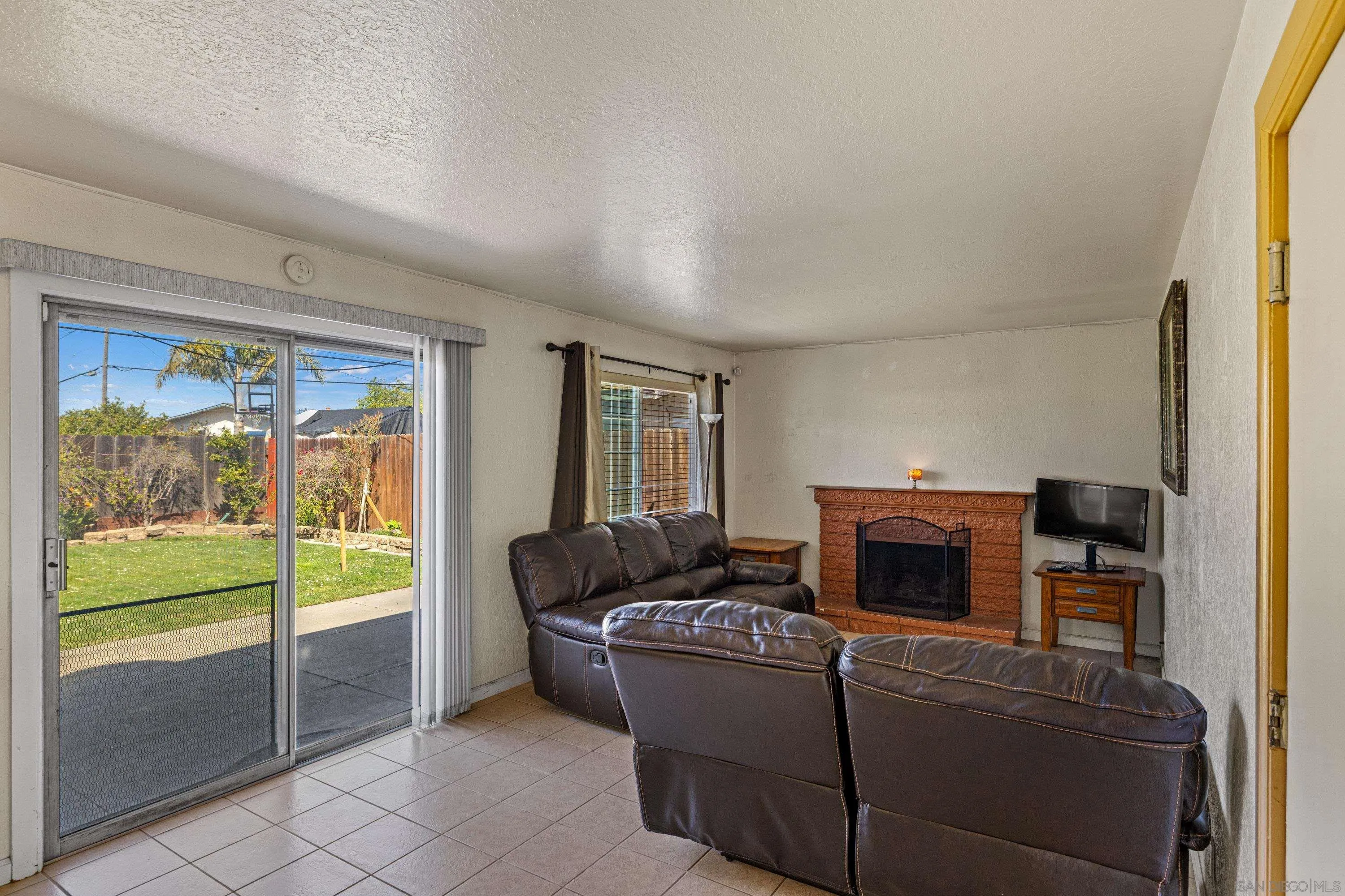 284 Osage Drive Salinas, CA 93906 - Photo 11 of 24 a living room with furniture and a floor to ceiling window