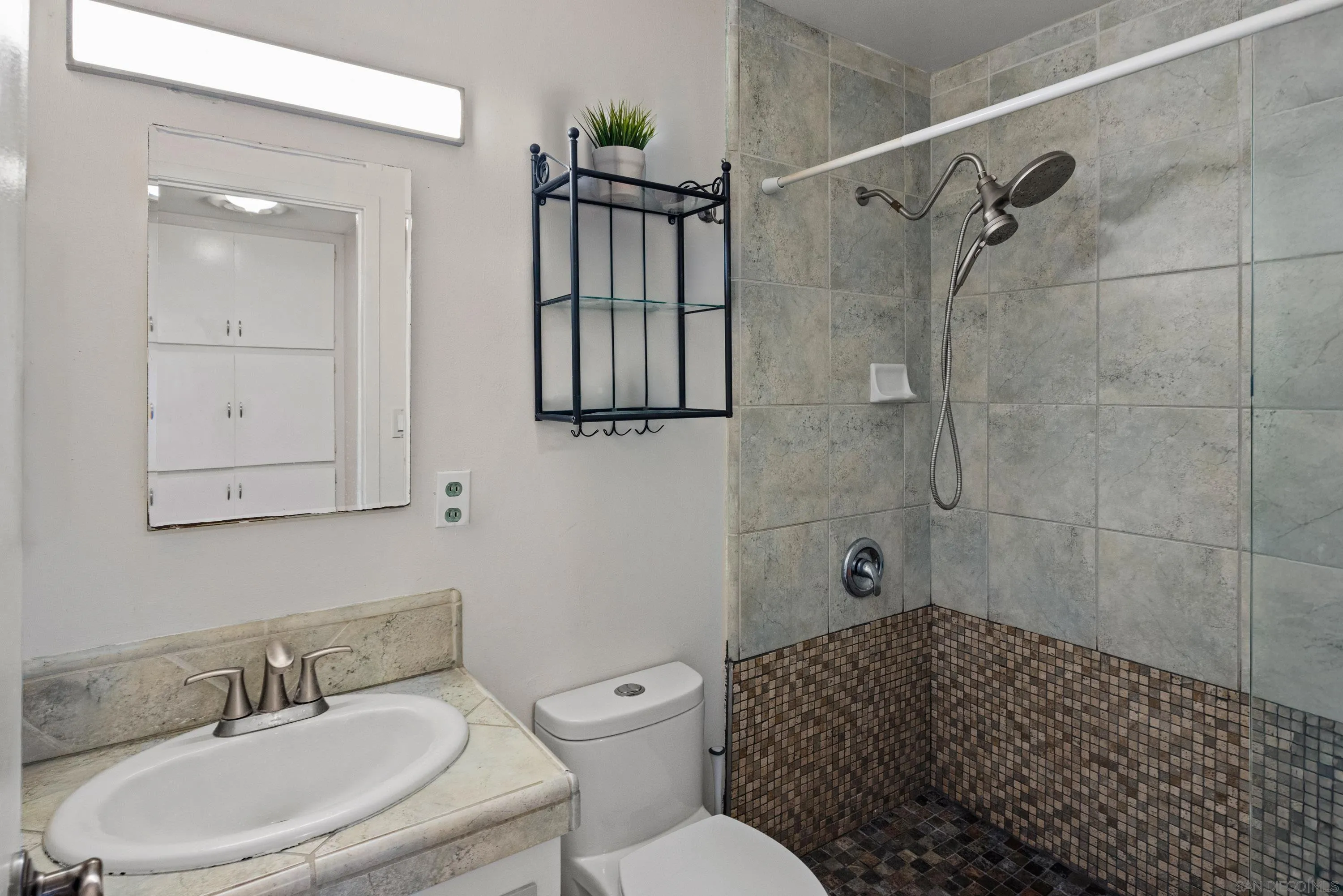 284 Osage Drive Salinas, CA 93906 - Photo 18 of 24 a bathroom with a sink toilet and shower