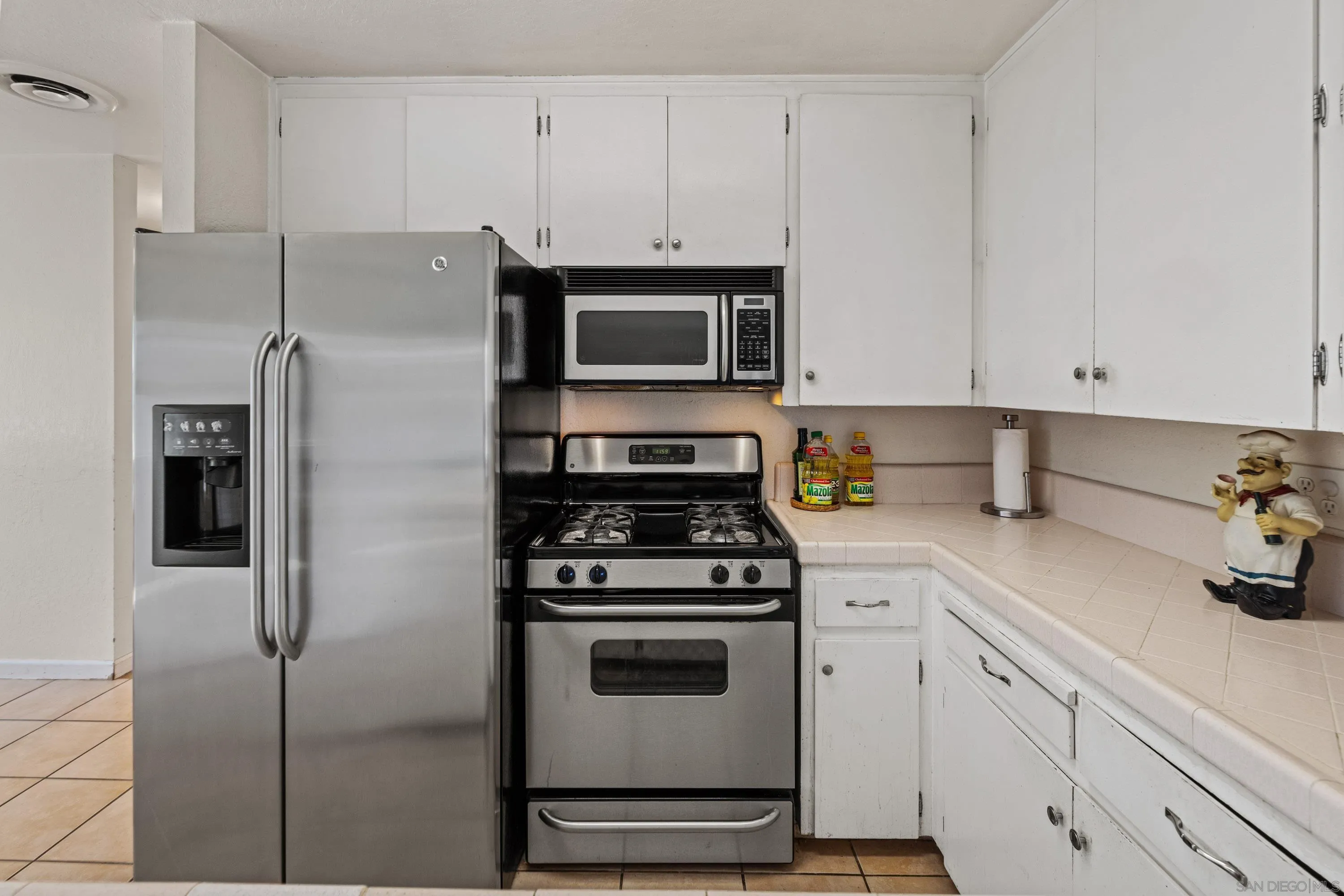 284 Osage Drive Salinas, CA 93906 - Photo 4 of 24 a kitchen with cabinets stainless steel appliances and a counter space