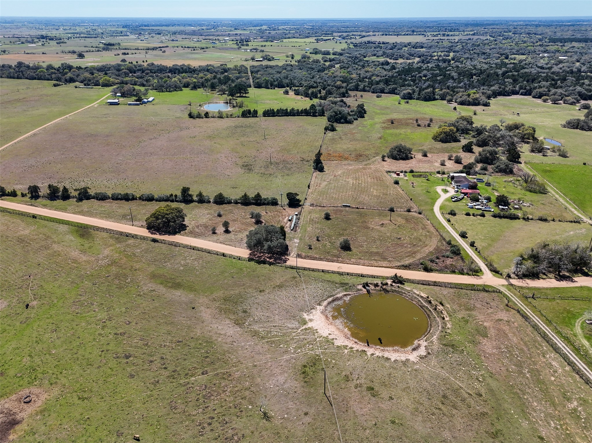 1 Reitz Quinn Road Cat Spring, TX 78933 - Photo 7 of 12 an aerial view of a house with a lake view