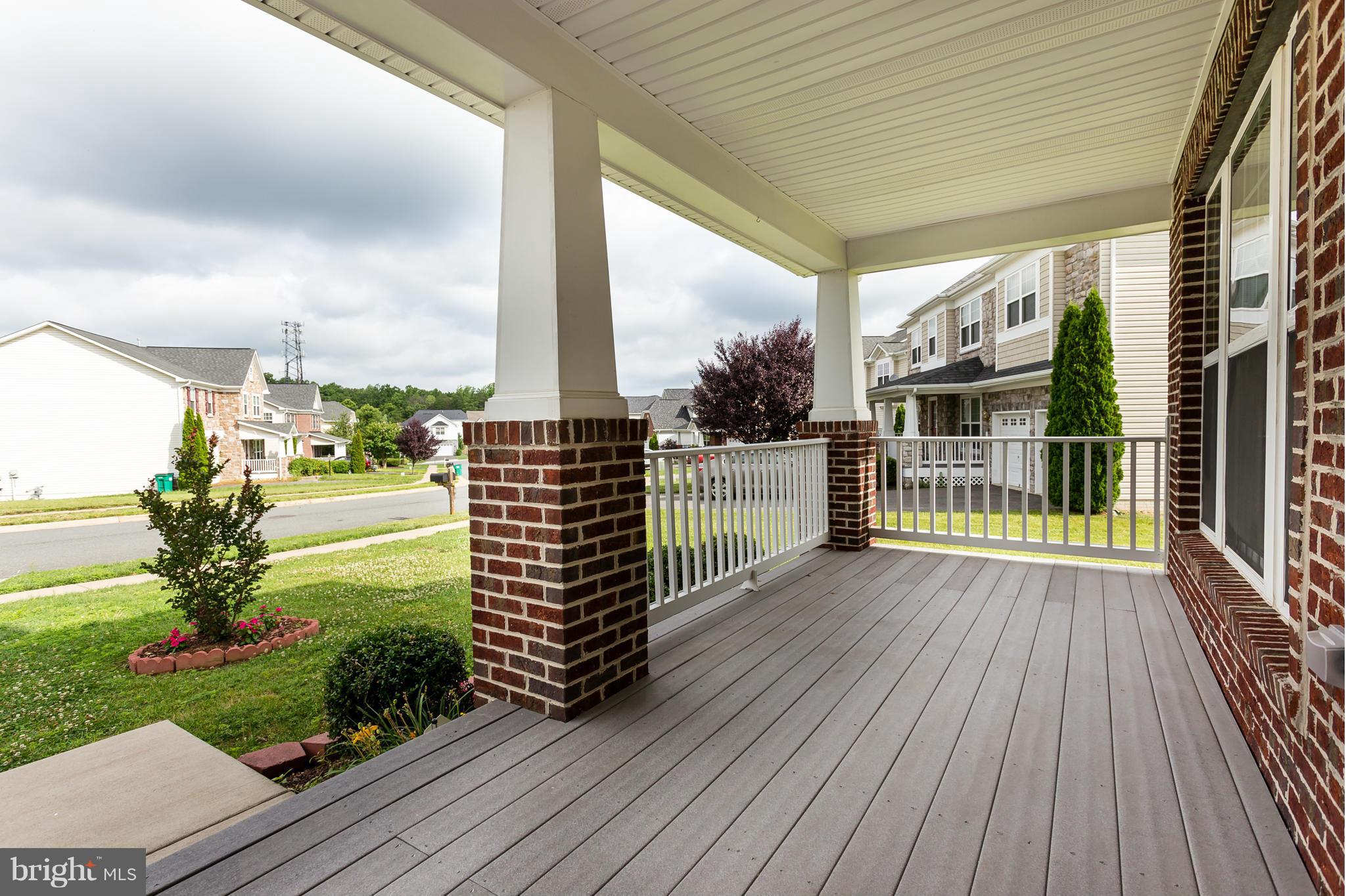 4141 Agency Loop Triangle, VA 22172 - Photo 3 of 30 a view of balcony with floor to ceiling windows and wooden floor