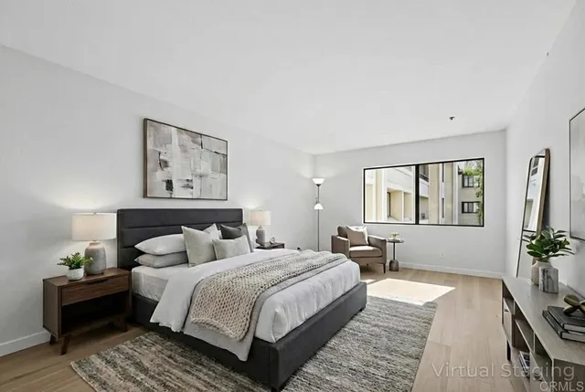 a bedroom with a bed and a couch