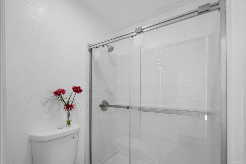 5745 Friars Road, Unit 116 San Diego, CA 92110 - Photo 24 of 44 a bathroom with a shower