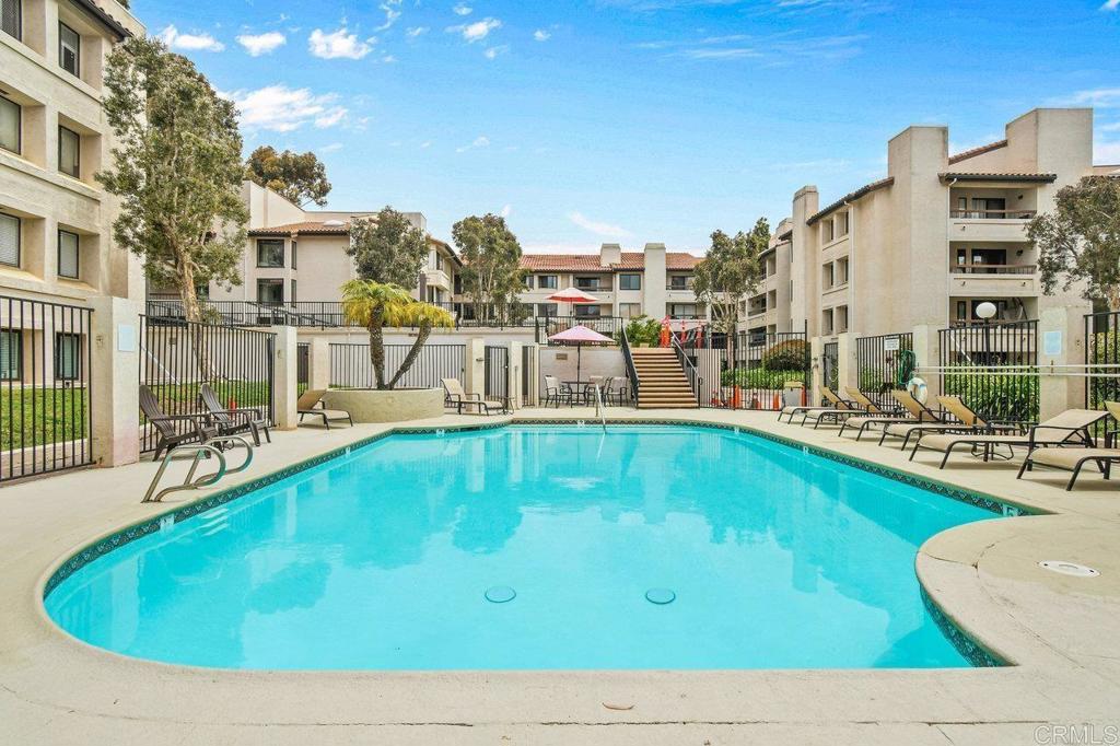 5745 Friars Road, Unit 116 San Diego, CA 92110 - Photo 41 of 44 a swimming pool with outdoor seating and yard