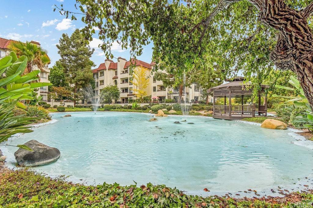 5745 Friars Road, Unit 116 San Diego, CA 92110 - Photo 42 of 44 a view of yard with swimming pool and sitting area