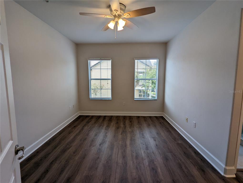 7782 Southwest 64th Lane, Unit 1002 Gainesville, FL 32608 - Photo 23 of 42 wooden floor in an empty room with a window