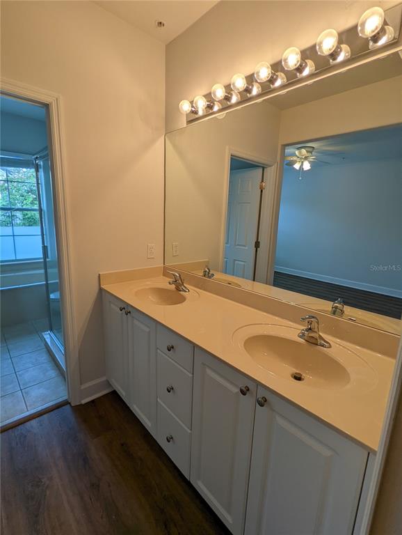 7782 Southwest 64th Lane, Unit 1002 Gainesville, FL 32608 - Photo 26 of 42 a bathroom with a double vanity sink and a mirror