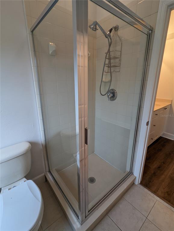 7782 Southwest 64th Lane, Unit 1002 Gainesville, FL 32608 - Photo 28 of 42 a bathroom with a glass shower door