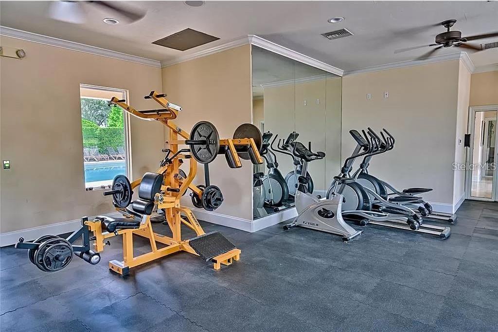7782 Southwest 64th Lane, Unit 1002 Gainesville, FL 32608 - Photo 39 of 42 a view of a room with gym equipment
