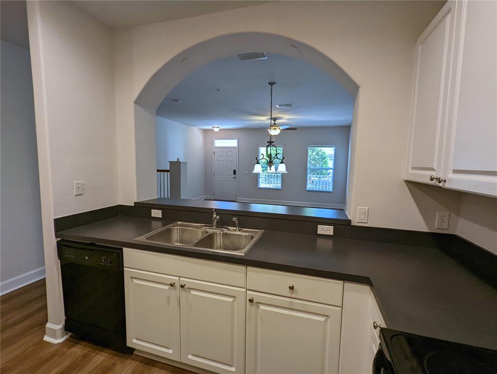 7782 Southwest 64th Lane, Unit 1002 Gainesville, FL 32608 - Photo 8 of 42 a kitchen with a sink and cabinets