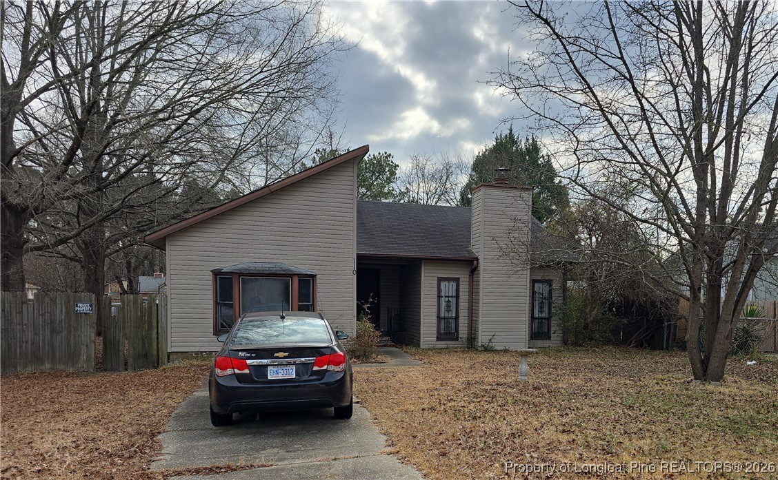 a car parked in front of a house
