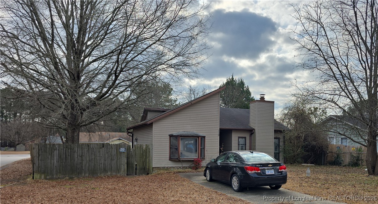 110 Maranatha Circle Spring Lake, NC 28390 - Photo 2 of 3 a car parked in front of a house