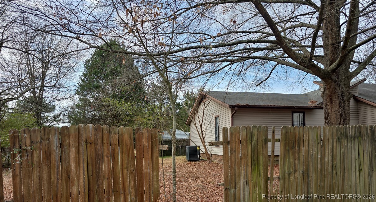 110 Maranatha Circle Spring Lake, NC 28390 - Photo 3 of 3 a front view of a house with a garden