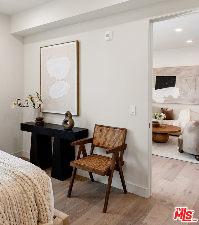 505 South Barrington Avenue, Unit 303 Los Angeles, CA 90049 - Photo 13 of 41 a bedroom with a bed and a table