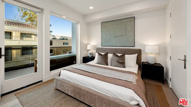 a bed room with a bed and cabinets