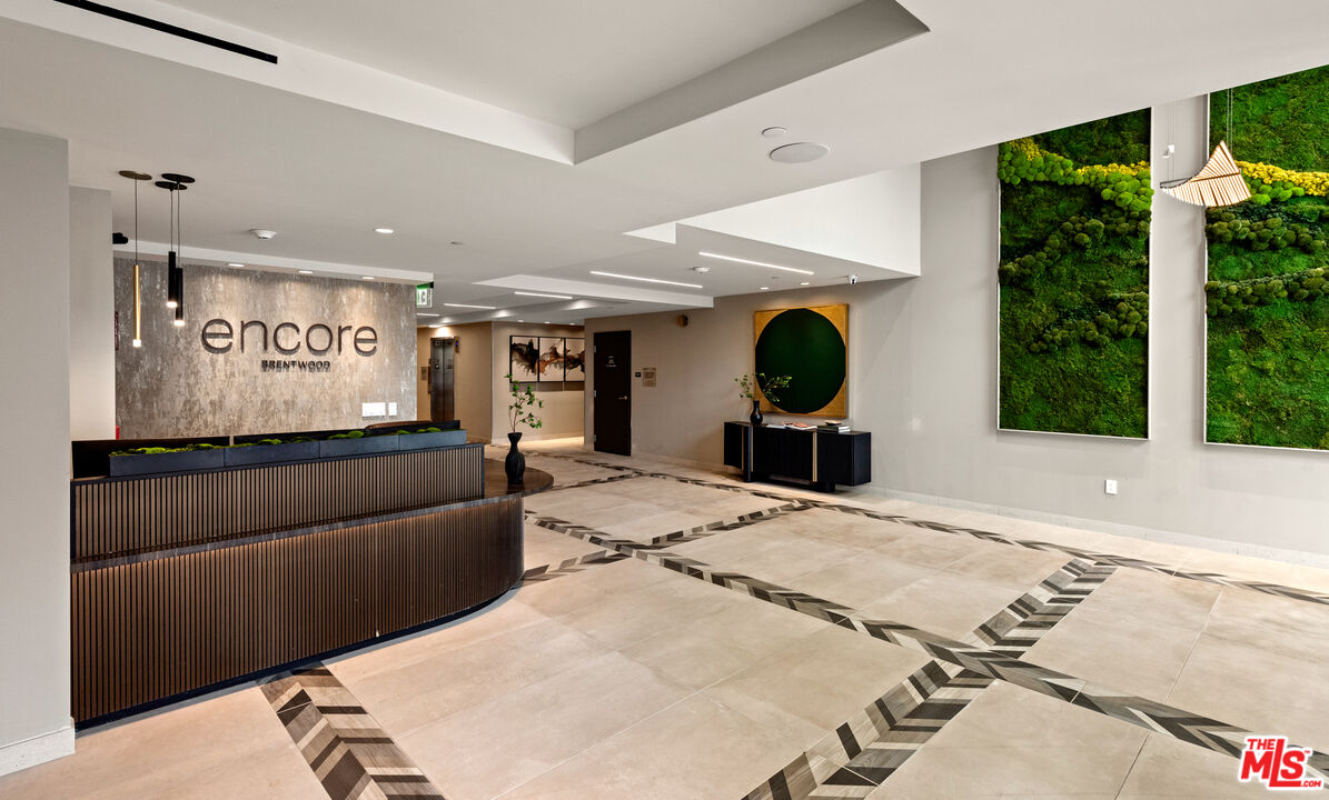 505 South Barrington Avenue, Unit 303 Los Angeles, CA 90049 - Photo 17 of 41 a living room with furniture and a large window