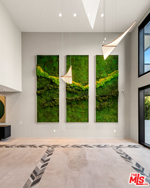 505 South Barrington Avenue, Unit 303 Los Angeles, CA 90049 - Photo 18 of 41 a view of a garden with an empty room and large window