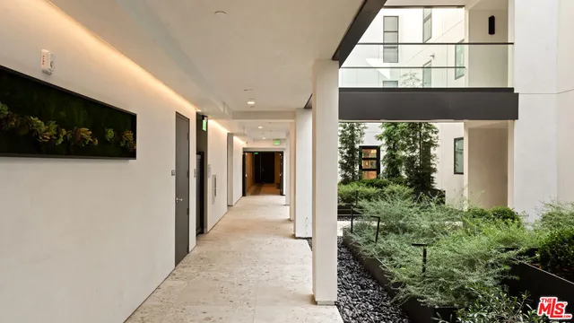 a view of a house with swimming pool and sitting area