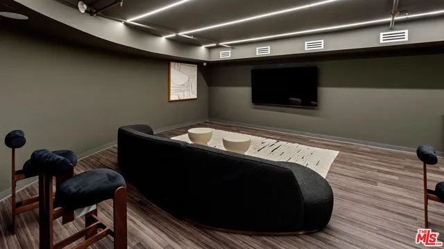 a view of a room that has a table and chairs in it