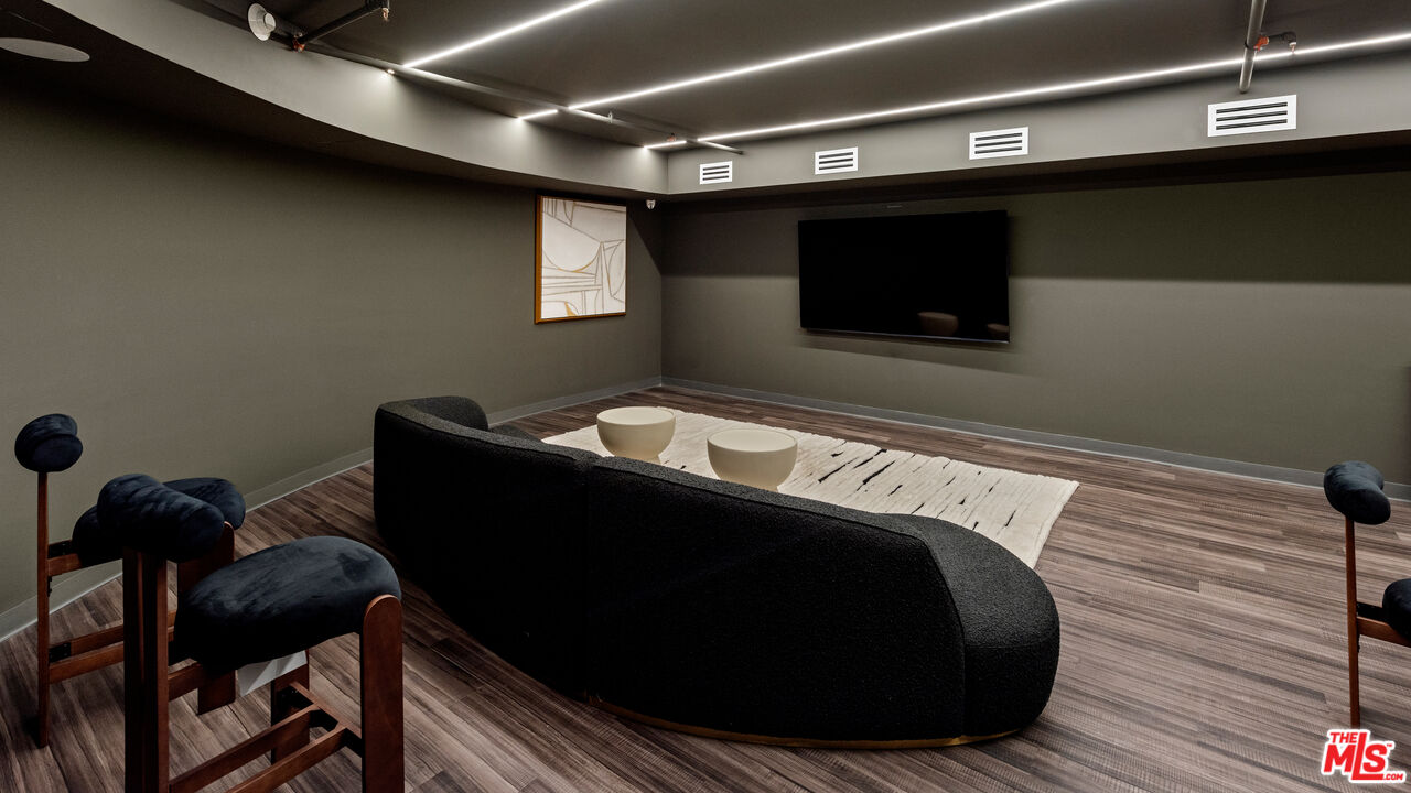 505 South Barrington Avenue, Unit 303 Los Angeles, CA 90049 - Photo 39 of 41 a bed sitting in a bedroom next to a window