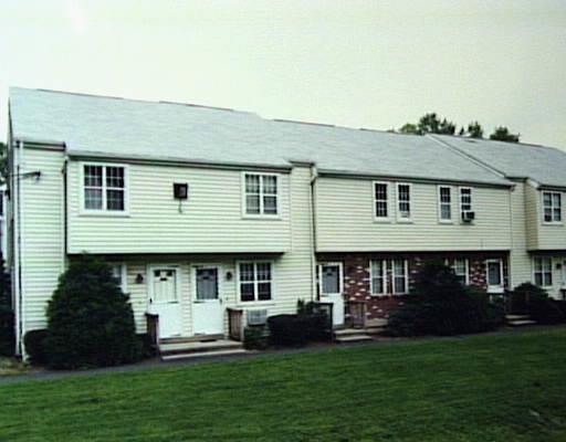14 Scuppo Road, Unit D1 Danbury, CT 06811 - Photo 1 of 1 a front view of a house with a garden
