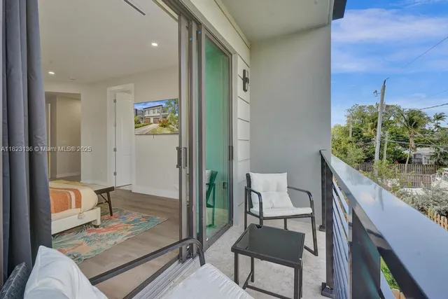 a view of a balcony with chairs