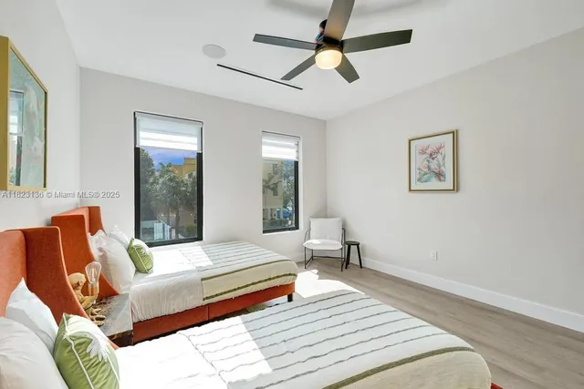 a bathroom with a sink toilet vanity and shower