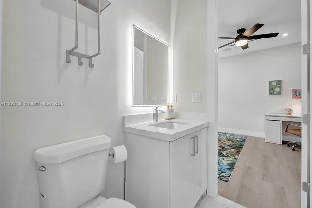 a bedroom with a bed and a desk