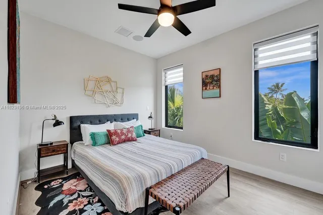 a bedroom with a bed and a lamp