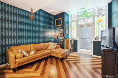 a blue couch sitting in front of a building