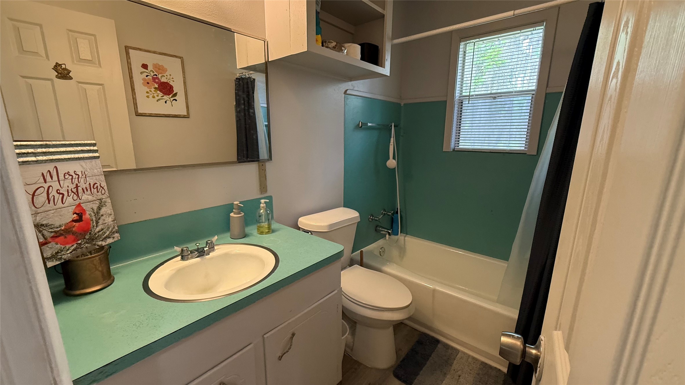 215 Weldon Livingston, TX 77351 - Photo 15 of 22 a bathroom with a toilet sink and mirror