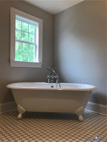a bathroom with a toilet a sink and a window