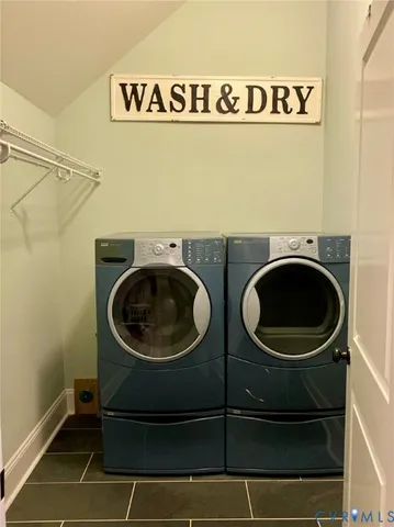 a front view of a house with a yard table and chairs