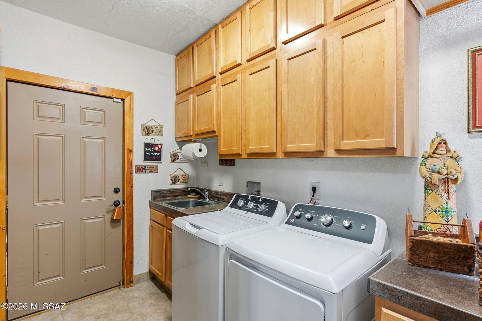 12810 West Gunsmoke Road Tucson, AZ 85736 - Photo 36 of 51 a view of storage and utility room with washer and dryer