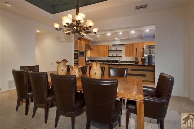70669 Boothill Road Rancho Mirage, CA 92270 - Photo 11 of 27 a dining room with furniture and chandelier