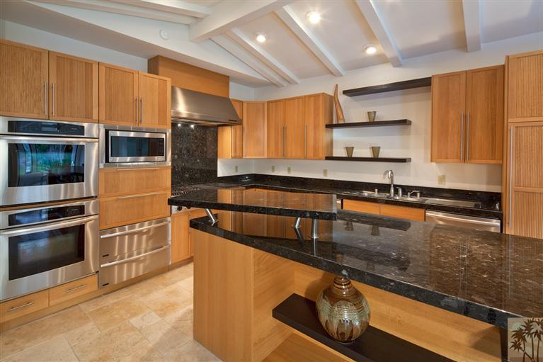 70669 Boothill Road Rancho Mirage, CA 92270 - Photo 12 of 27 a kitchen with stainless steel appliances granite countertop a stove a sink and a microwave