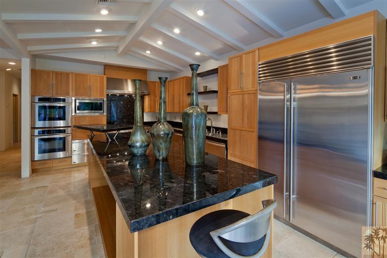 70669 Boothill Road Rancho Mirage, CA 92270 - Photo 13 of 27 a kitchen with stainless steel appliances granite countertop a refrigerator a stove and a sink